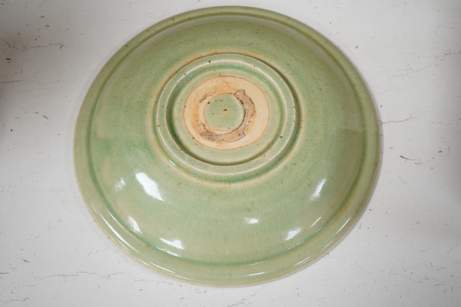 A South East Asian celadon glazed twin fish dish, 26cm diameter